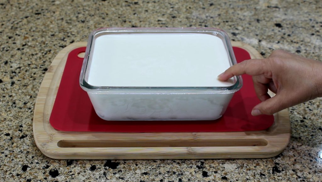 Scooping Creamy Coconut Ice Cream