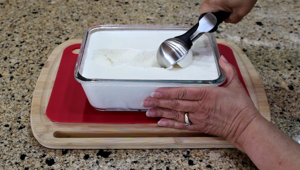 Scooping Creamy Coconut Ice Cream 
