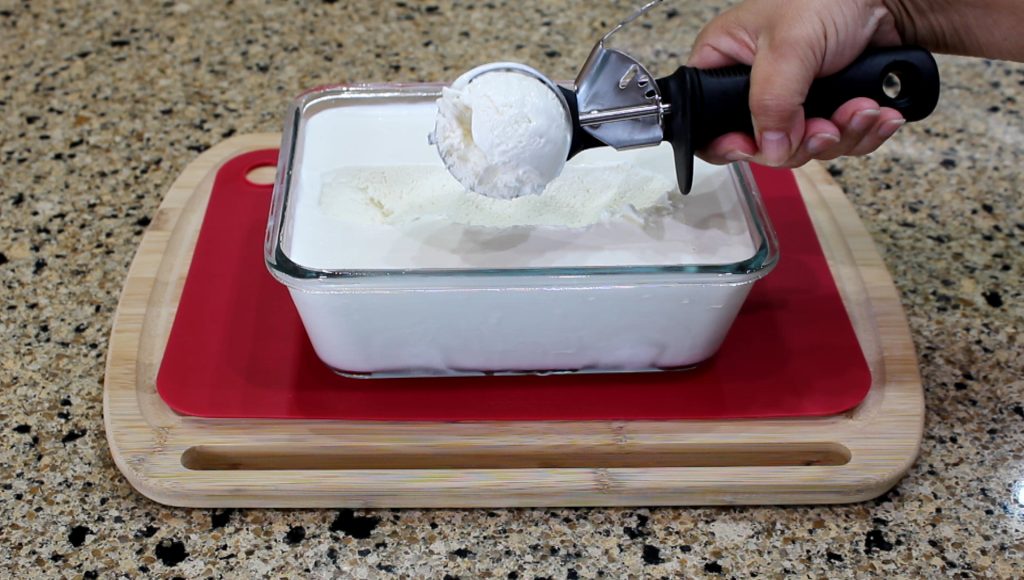 Scooping Creamy Coconut Ice Cream